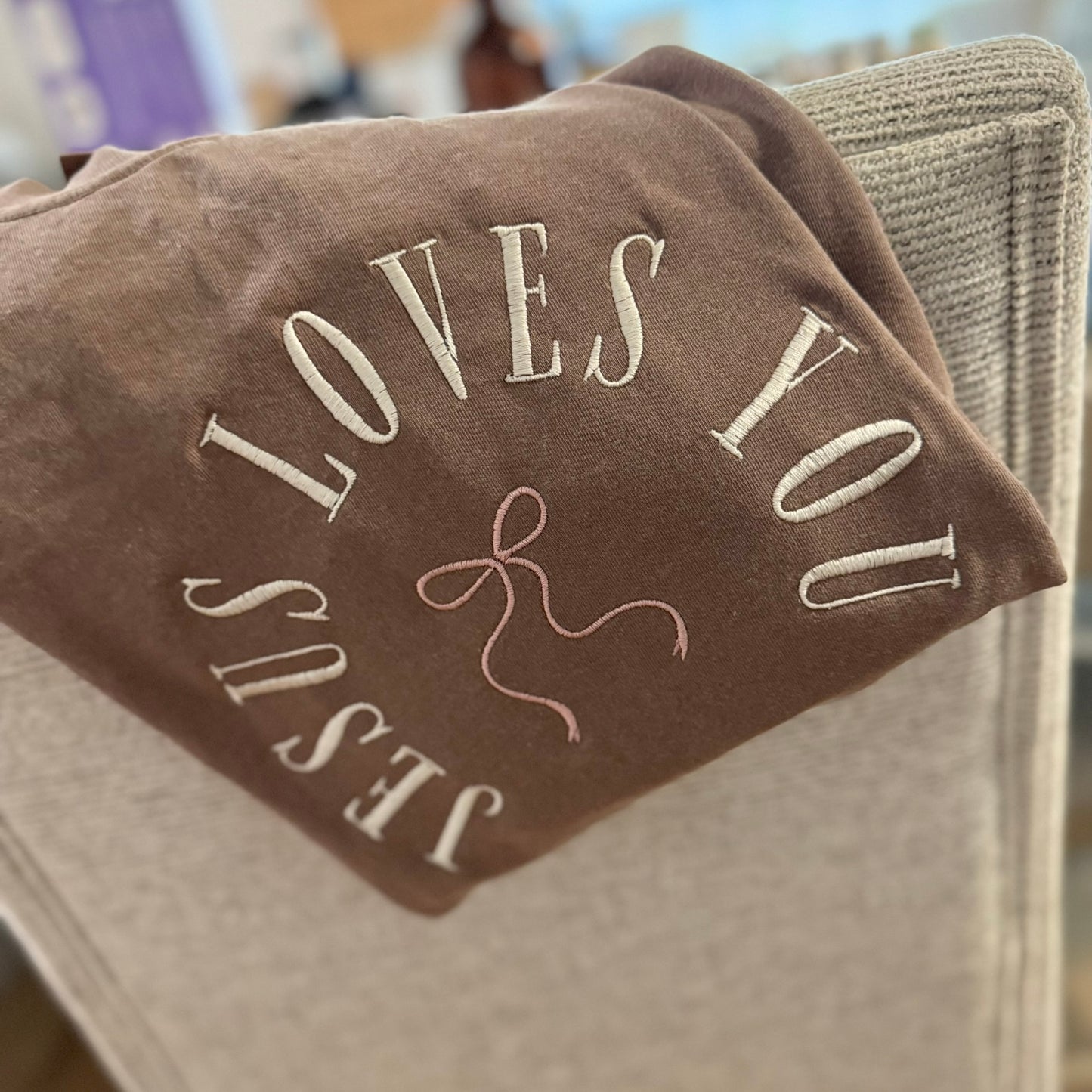 Jesus Loves You Embroidered Shirt  – Neutral Faith-Based Design with Bow Accent